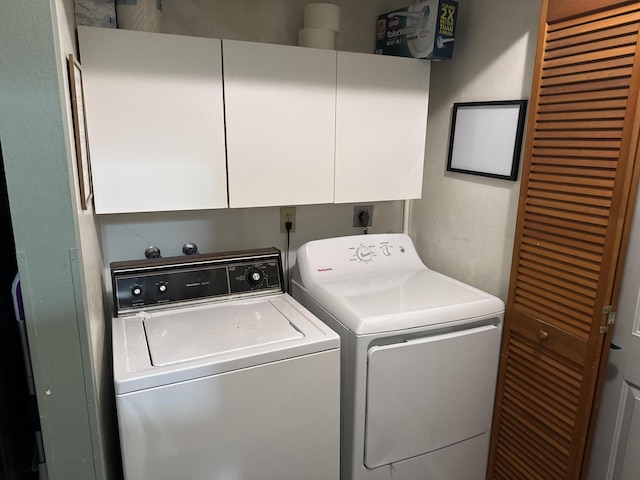 laundry area featuring cabinet space and washing machine and dryer