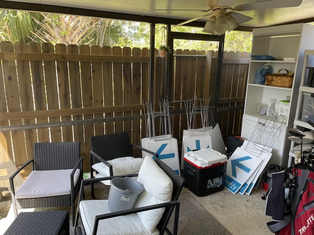 view of patio / terrace with ceiling fan and fence