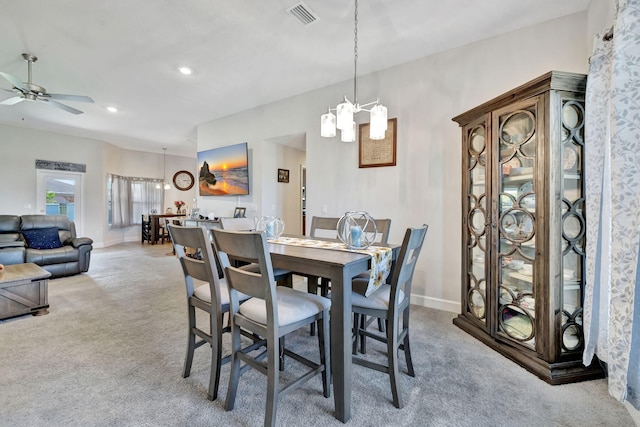 dining area featuring visible vents, light carpet, ceiling fan with notable chandelier, recessed lighting, and baseboards