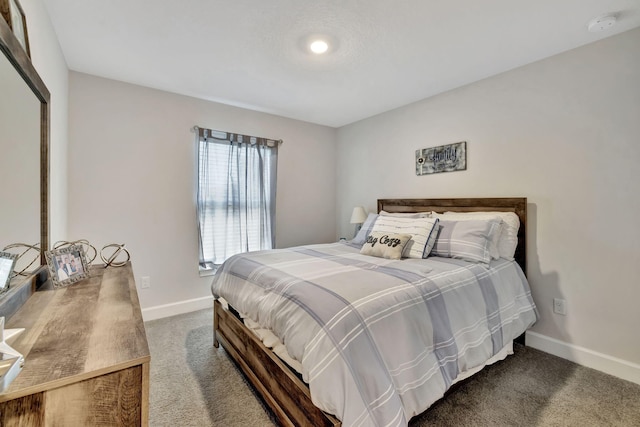 bedroom featuring carpet and baseboards