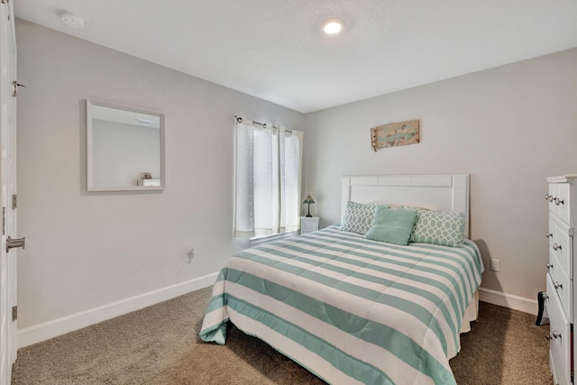 bedroom featuring baseboards and carpet floors