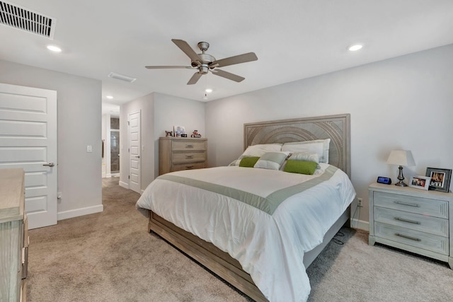 bedroom with recessed lighting, baseboards, visible vents, and light carpet