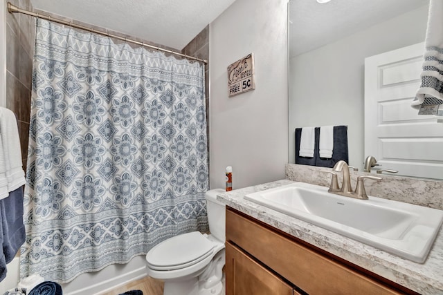 full bath with shower / bathtub combination with curtain, toilet, vanity, and a textured ceiling