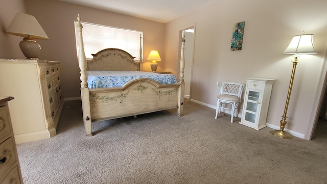 carpeted bedroom with baseboards
