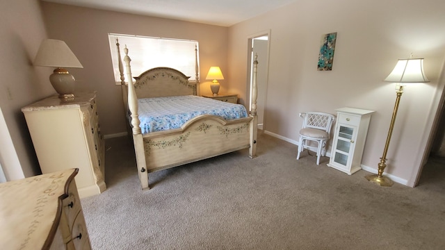 carpeted bedroom with baseboards