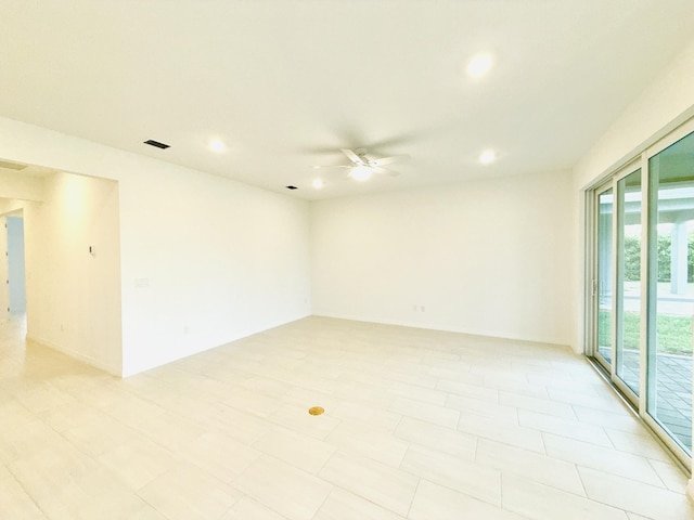 spare room featuring recessed lighting, visible vents, and a ceiling fan