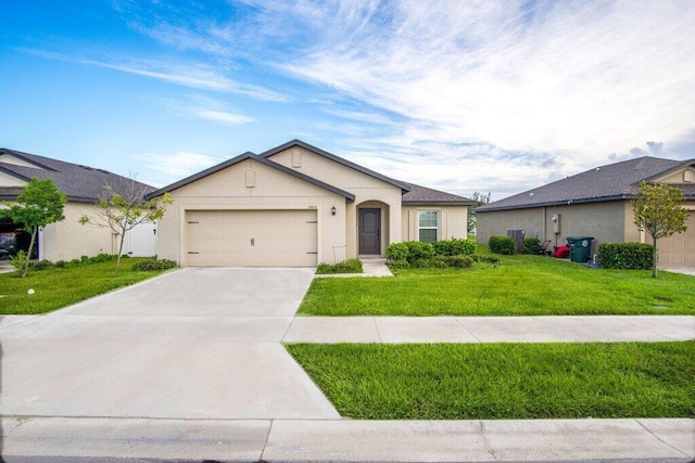 ranch-style house with stucco siding, driveway, an attached garage, and a front yard