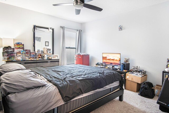 carpeted bedroom featuring a ceiling fan