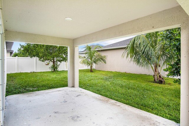 view of yard with a fenced backyard and a patio