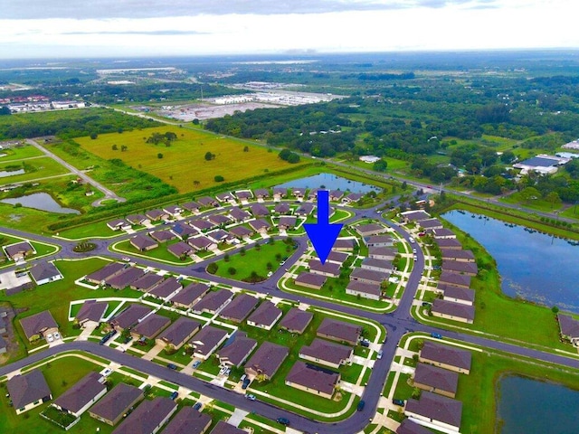 aerial view with a residential view and a water view