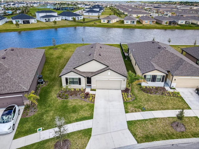 aerial view with a residential view and a water view