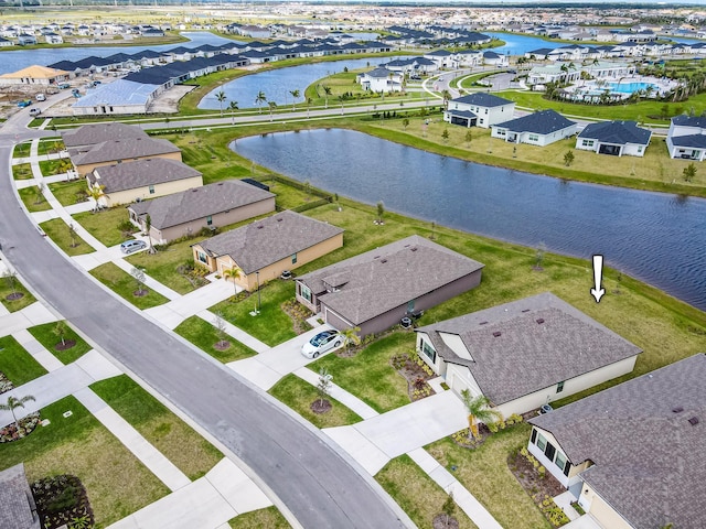 aerial view with a residential view and a water view