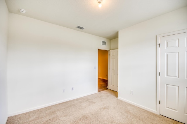 unfurnished bedroom with visible vents, baseboards, and carpet floors