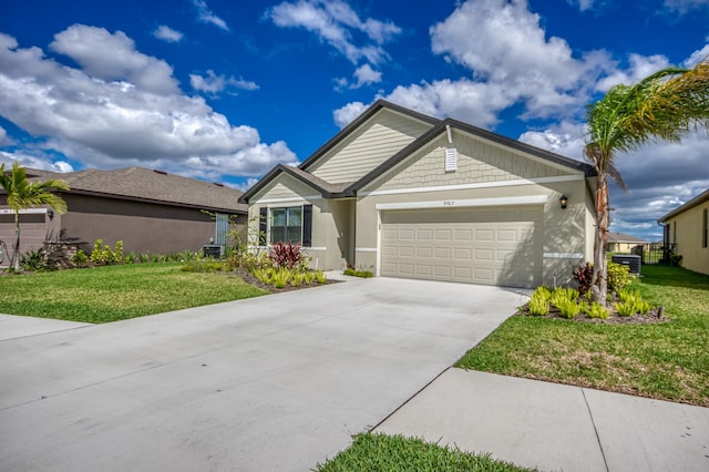 view of front facade with stucco siding, an attached garage, concrete driveway, and a front yard