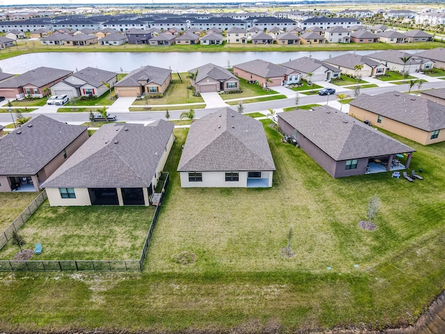 aerial view featuring a residential view and a water view