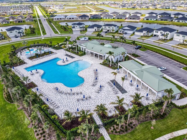 birds eye view of property with a residential view