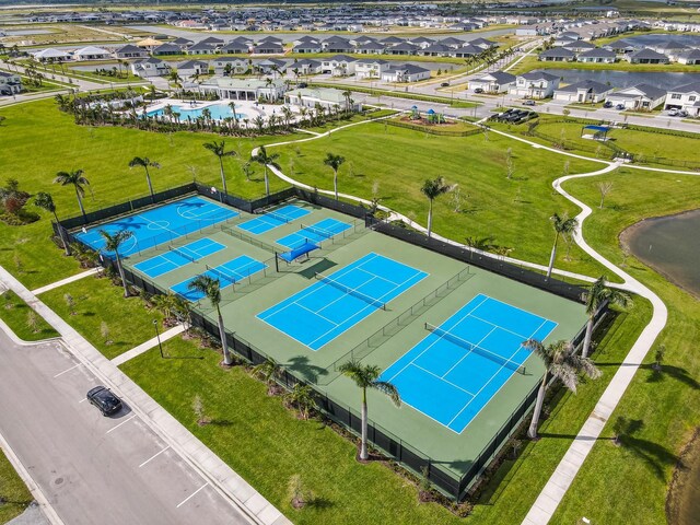 birds eye view of property with a residential view