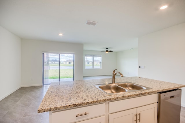 kitchen with visible vents, a sink, open floor plan, white cabinets, and dishwasher