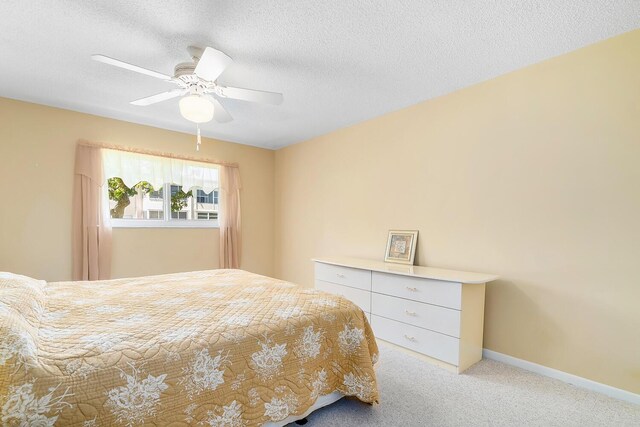 kitchen featuring tasteful backsplash, visible vents, light countertops, white appliances, and a sink