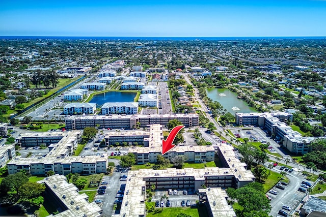 birds eye view of property featuring a water view