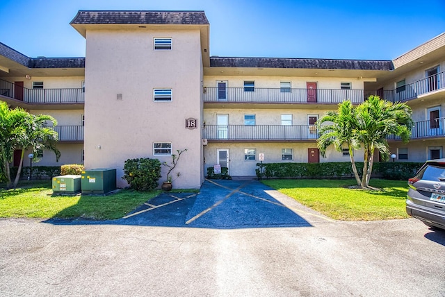 view of property with uncovered parking