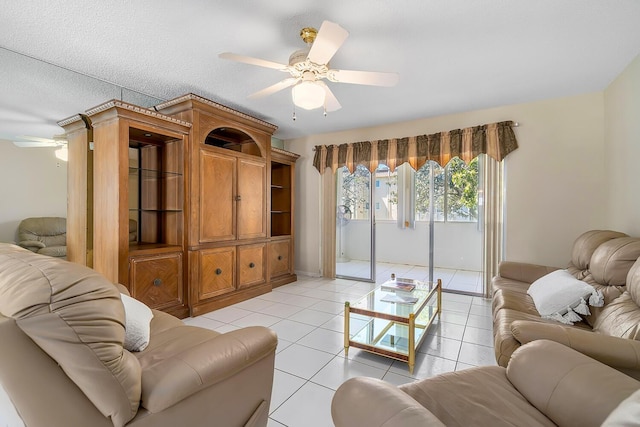 living room with light tile patterned floors and ceiling fan