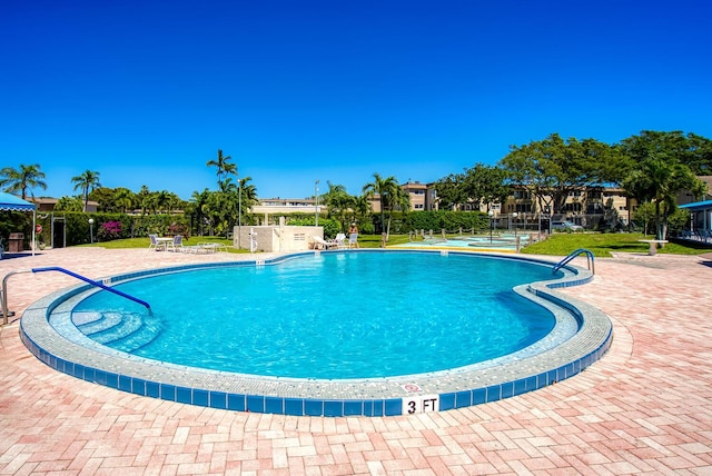 pool with a patio area