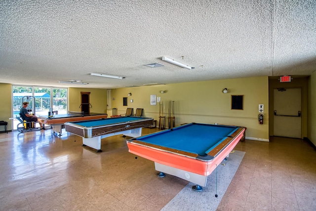 game room featuring tile patterned floors, a textured ceiling, and billiards