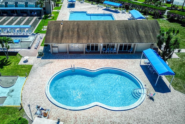 community pool featuring a patio area