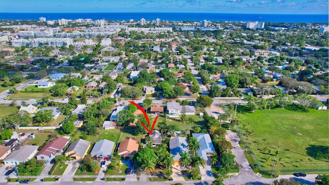 bird's eye view featuring a residential view and a water view