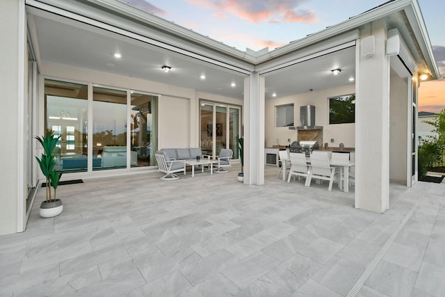 20017 SE Bridgewater Dr, Jupiter, FL 33458 - patio terrace at dusk featuring a patio, an outdoor hangout area, outdoor dining area, and area for grilling