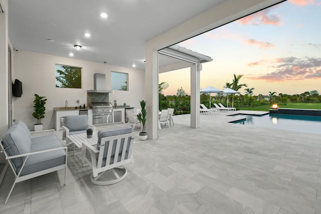 20017 SE Bridgewater Dr, Jupiter, FL 33458 - patio terrace at dusk with a patio area, an outdoor hangout area, an outdoor pool, and a sink