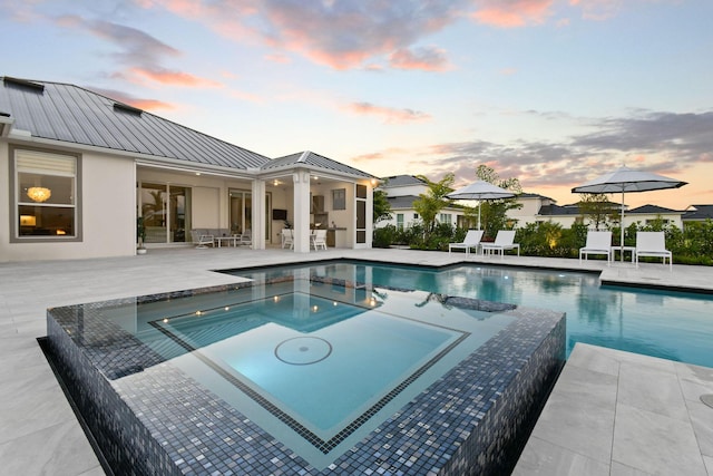 20017 SE Bridgewater Dr, Jupiter, FL 33458 - view of swimming pool featuring a patio and a pool with connected hot tub