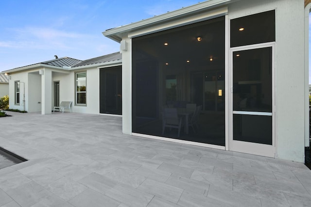 20017 SE Bridgewater Dr, Jupiter, FL 33458 - view of patio / terrace featuring a sunroom