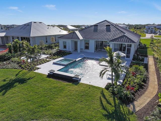 20017 SE Bridgewater Dr, Jupiter, FL 33458 - view of swimming pool with a patio area, a pool with connected hot tub, and a sunroom