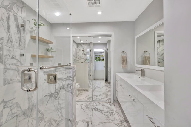 full bathroom featuring visible vents, a marble finish shower, a sink, toilet, and marble finish floor