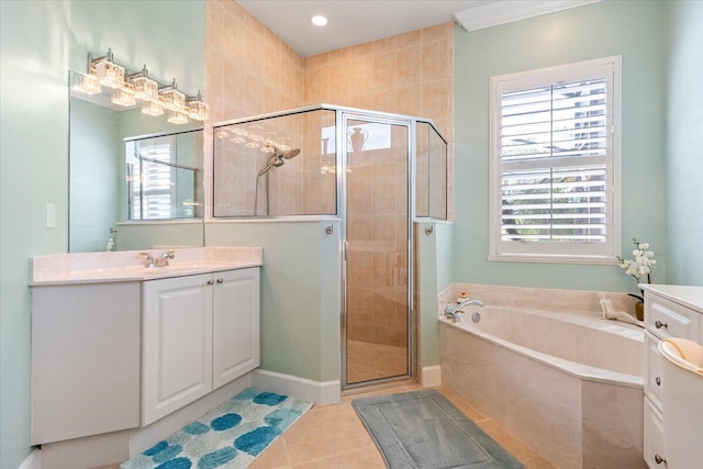 full bath featuring baseboards, a garden tub, a stall shower, tile patterned floors, and vanity