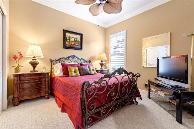 bedroom featuring a ceiling fan, baseboards, carpet, and crown molding