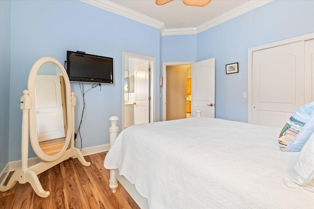 bedroom featuring wood finished floors, baseboards, ceiling fan, ornamental molding, and connected bathroom