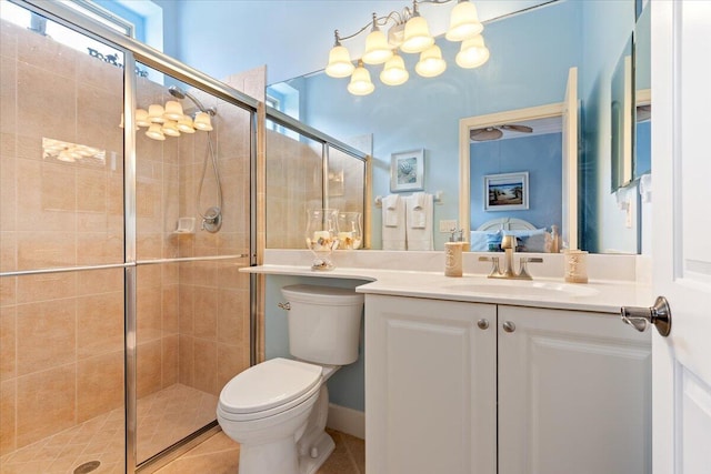 full bathroom with tile patterned floors, vanity, toilet, and a shower stall