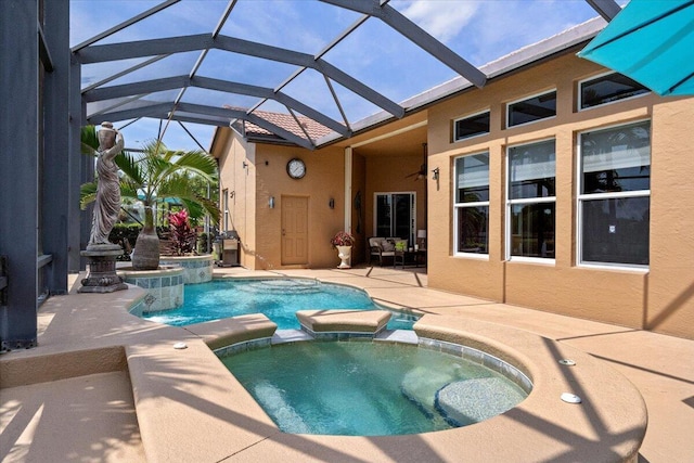 view of pool featuring a patio area and a pool with connected hot tub