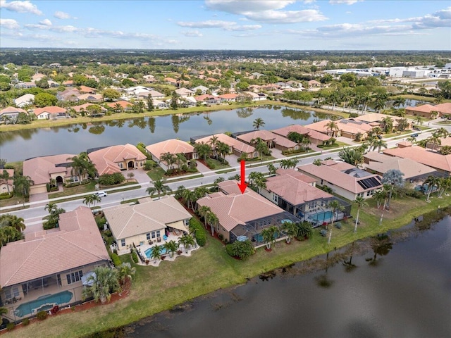 birds eye view of property featuring a residential view and a water view