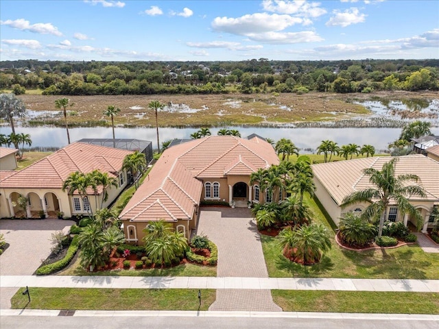 birds eye view of property with a water view