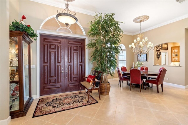 entryway with visible vents, ornamental molding, light tile patterned flooring, baseboards, and a chandelier