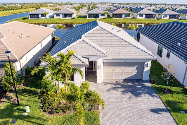 bird's eye view featuring a residential view and a water view