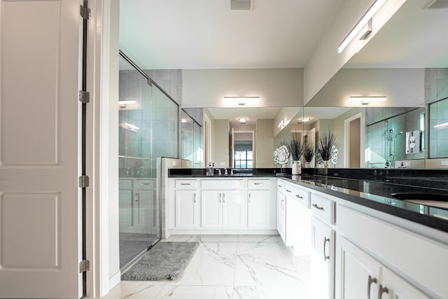 full bath with visible vents, vanity, marble finish floor, and a shower stall