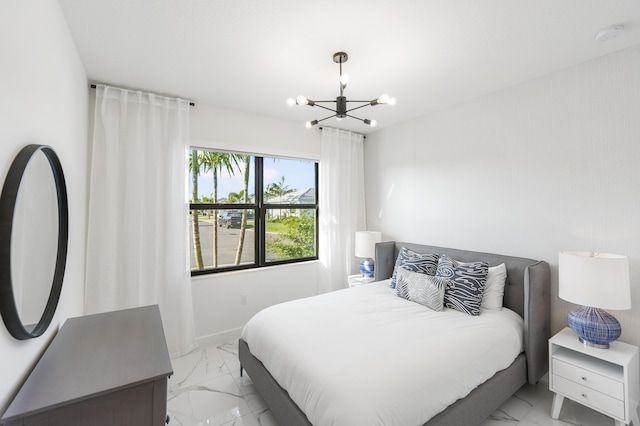 bedroom featuring a notable chandelier, baseboards, and marble finish floor