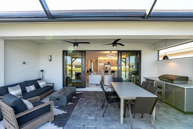 view of patio / terrace with a ceiling fan, an outdoor living space, area for grilling, outdoor dining area, and a lanai