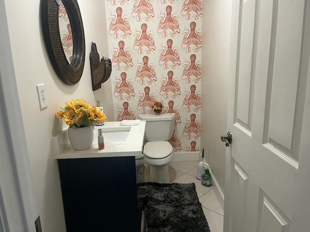 bathroom featuring vanity, baseboards, tile patterned flooring, a shower, and toilet