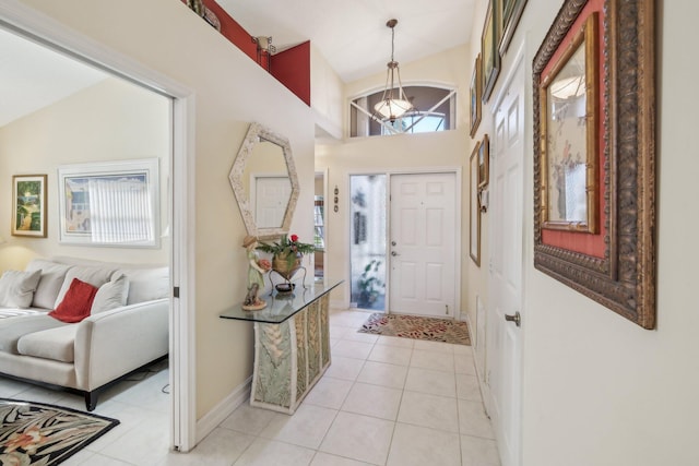 foyer with light tile patterned floors and baseboards